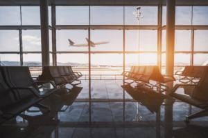 Plane taking off in front of airport